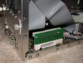 The PCI riser installed, with the HD cable bent above